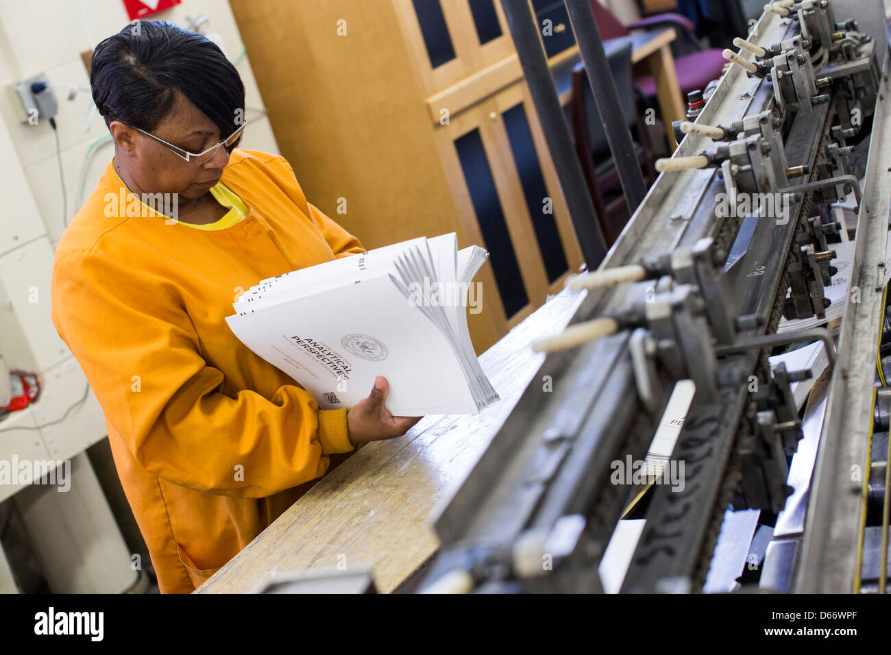 Copies of the fiscal year 2014 Federal Budget are bound at the Government Printing Office. Stock Photo