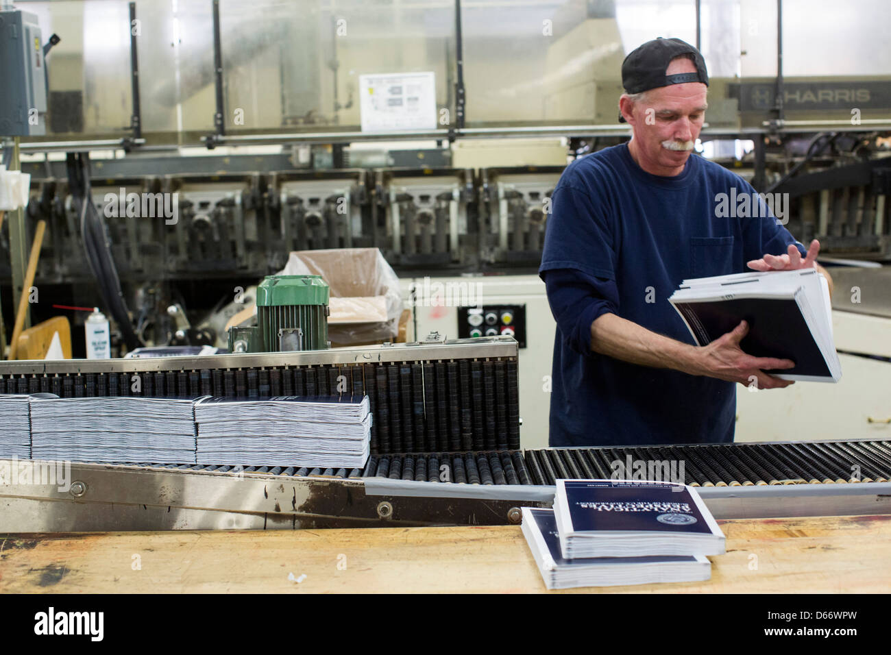 Copies of the fiscal year 2014 Federal Budget are bound at the Government Printing Office. Stock Photo