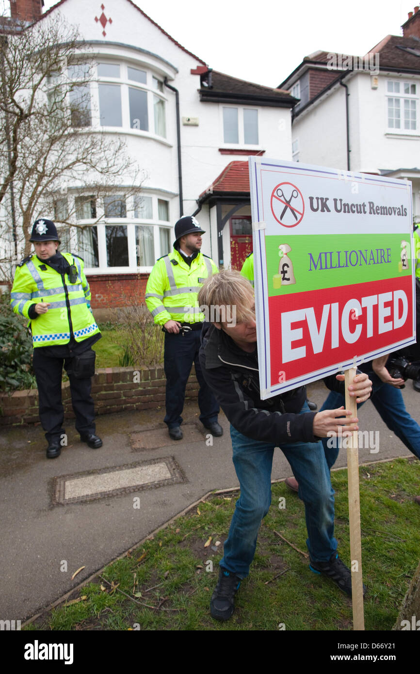London, UK. 13 April 2013. Bedroom Tax protest, Highgate, North London, England, UK. Hundreds of anti-cuts activists delivered 'eviction notices' to the home of Lord Freud in civil disobedience actions to protest at the Government's controversial welfare changes. The effect of the so-called 'bedroom tax' is being highlighted, with protesters taking beds with them during the demonstrations, and removal trucks unloading furniture into the streets. Jeff Gilbert/Aamy Live News Stock Photo