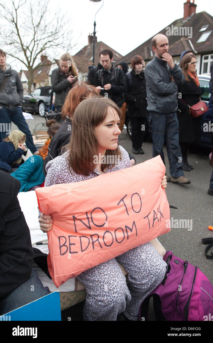 London, UK. 13 April 2013. Bedroom Tax protest, Highgate, North London, England, UK. Hundreds of anti-cuts activists delivered 'eviction notices' to the home of Lord Freud in civil disobedience actions to protest at the Government's controversial welfare changes. The effect of the so-called 'bedroom tax' is being highlighted, with protesters taking beds with them during the demonstrations, and removal trucks unloading furniture into the streets. Jeff Gilbert/Aamy Live News Stock Photo