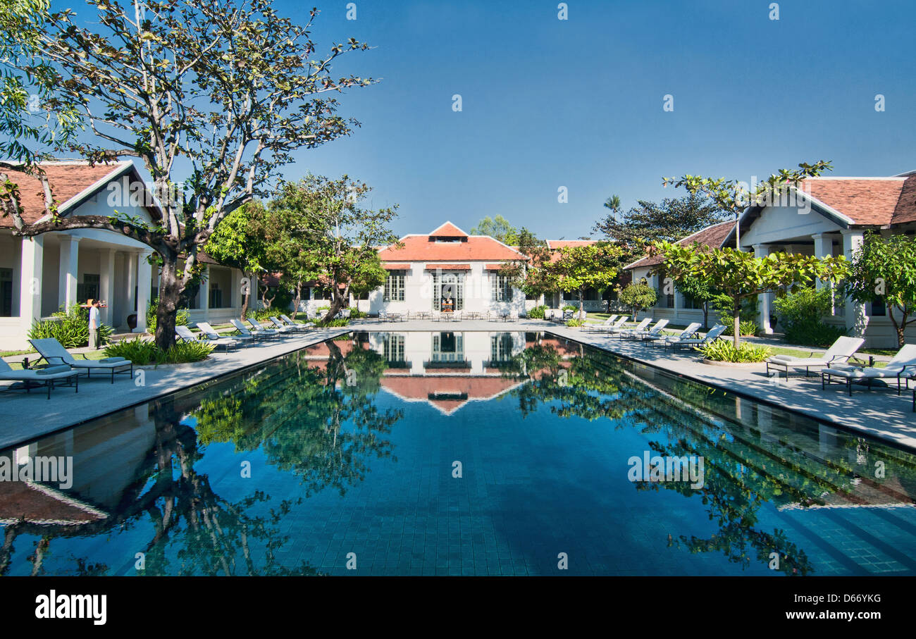 restored French colonial architecture and swimming pool, Luang Prabang, Laos Stock Photo