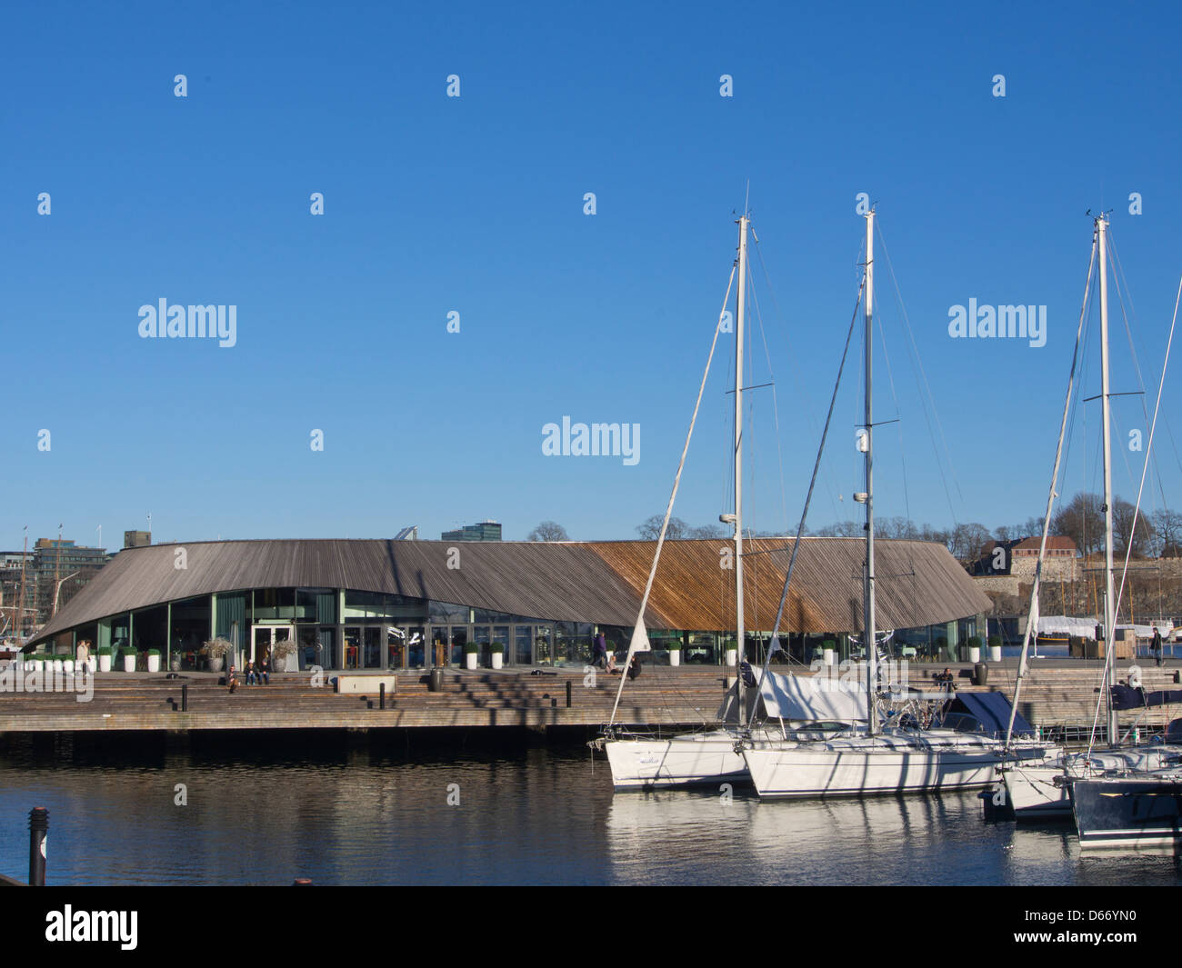 Modern architecture in the Aker Brygge area of the harbour in Oslo Norway wavy facade in wood and glass for the restaurant Onda Stock Photo