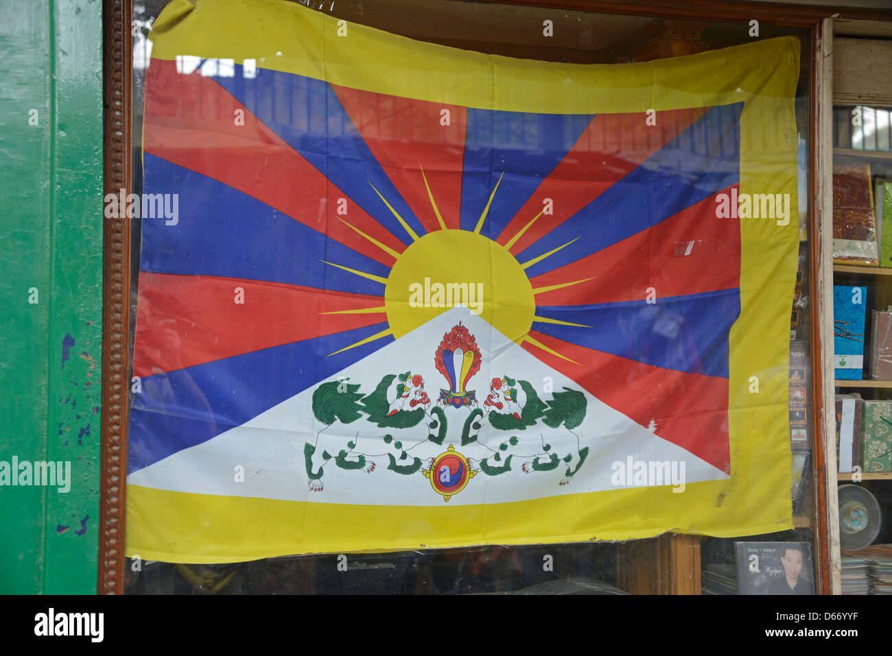 The Tibetan national flag is displayed in a shop window in the Majnu Ka Tila Tibetan refugee camp in Delhi, India Stock Photo