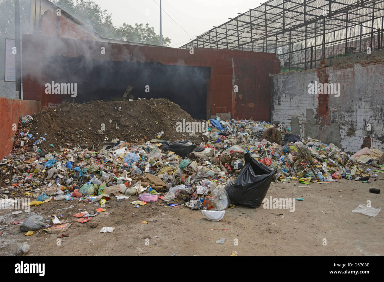A burning pile of street rubbish in a slum area of Old Delhi in India Stock Photo