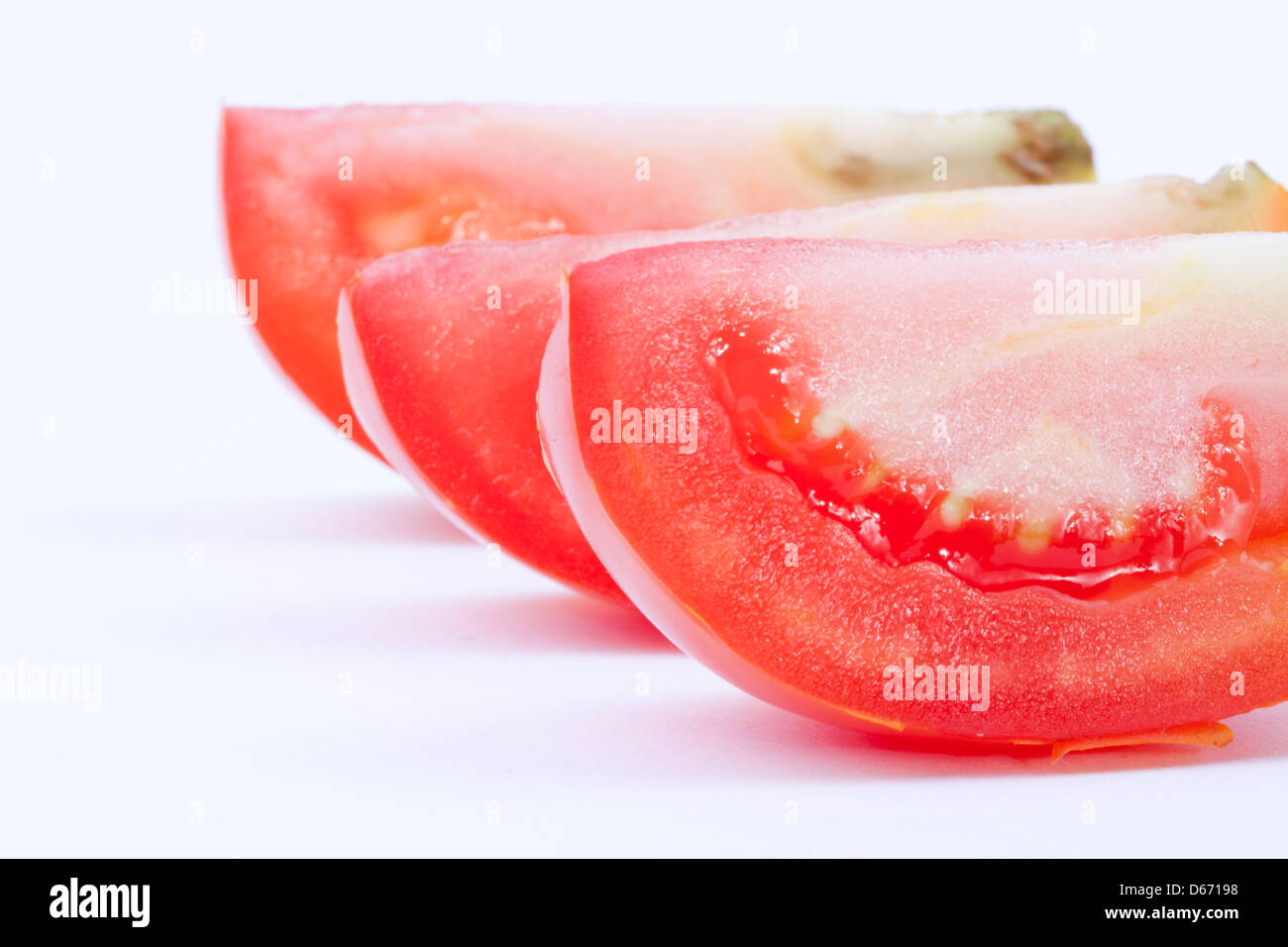 Slice tomato with three slice and white background Stock Photo