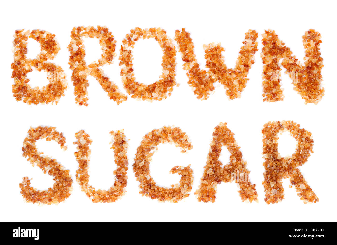 word BROWN SUGAR laid brown sugar. Isolate on white. Stock Photo
