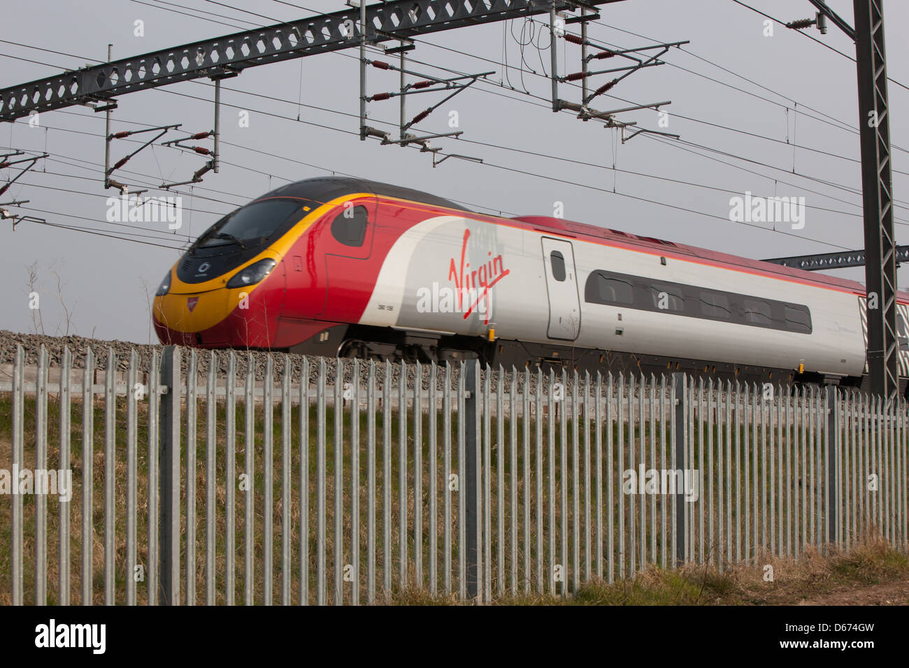 A Virgin train on the West Coast Mainline in the Midlands. Stock Photo