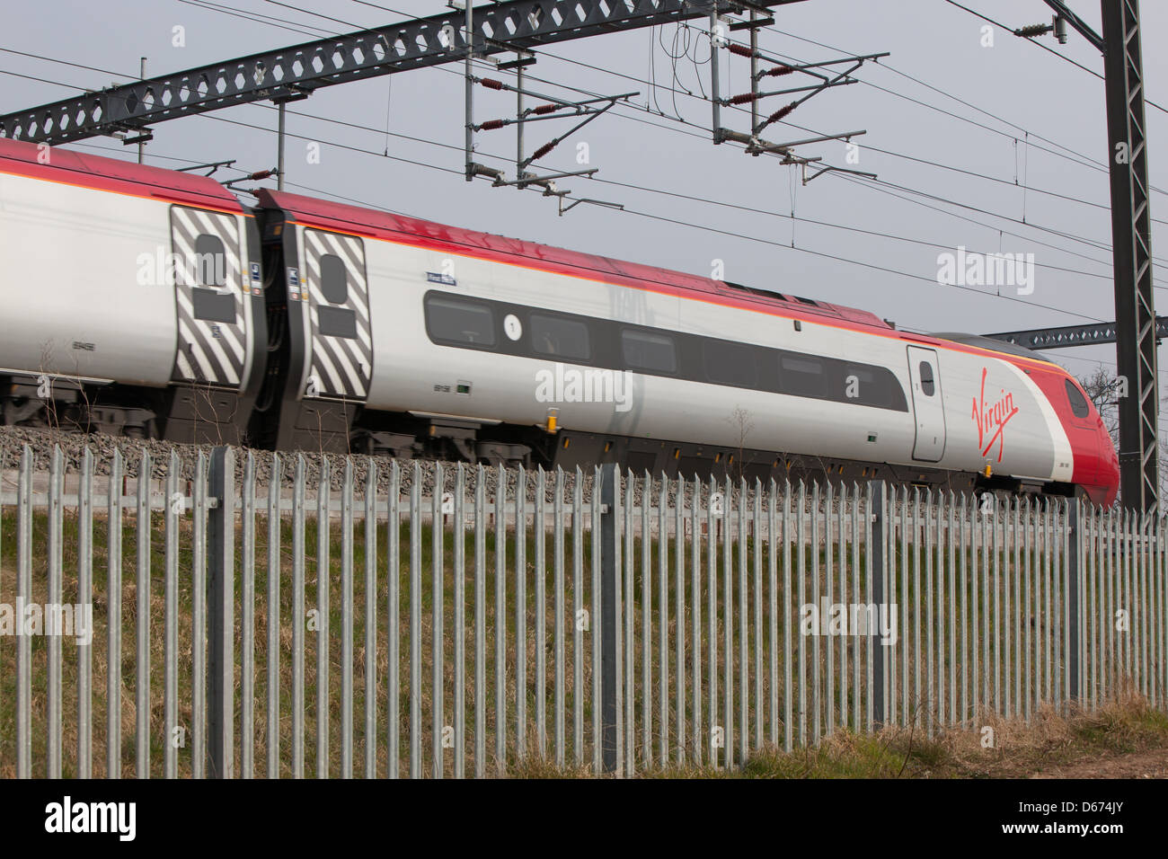 A Virgin train on the West Coast Mainline in the Midlands. Stock Photo