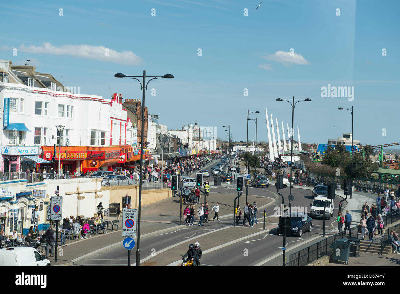Southend, Essex. 14 April 2013. The predicted warm weather and sunshine eventually arrives. A large number of people went to the traditional seaside town of Southend on Sea. Marine Parade recently regenerated is now a shared space for pedestrians and vehicles but is causing controversy with safety campaigners. Allsorts Stock Photo/Alamy Live News Stock Photo