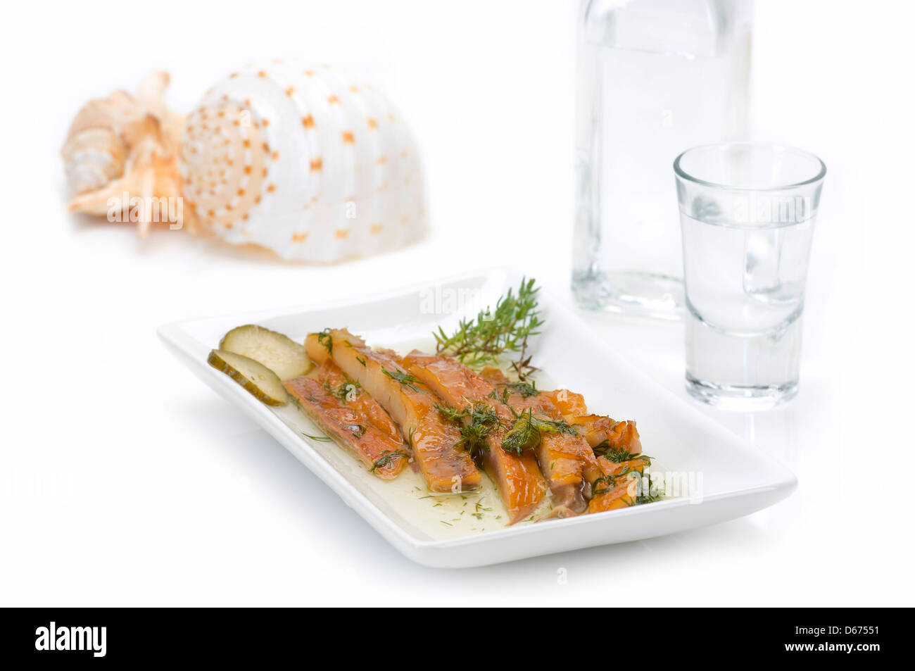 sun dried fish fillet served with ouzo Stock Photo