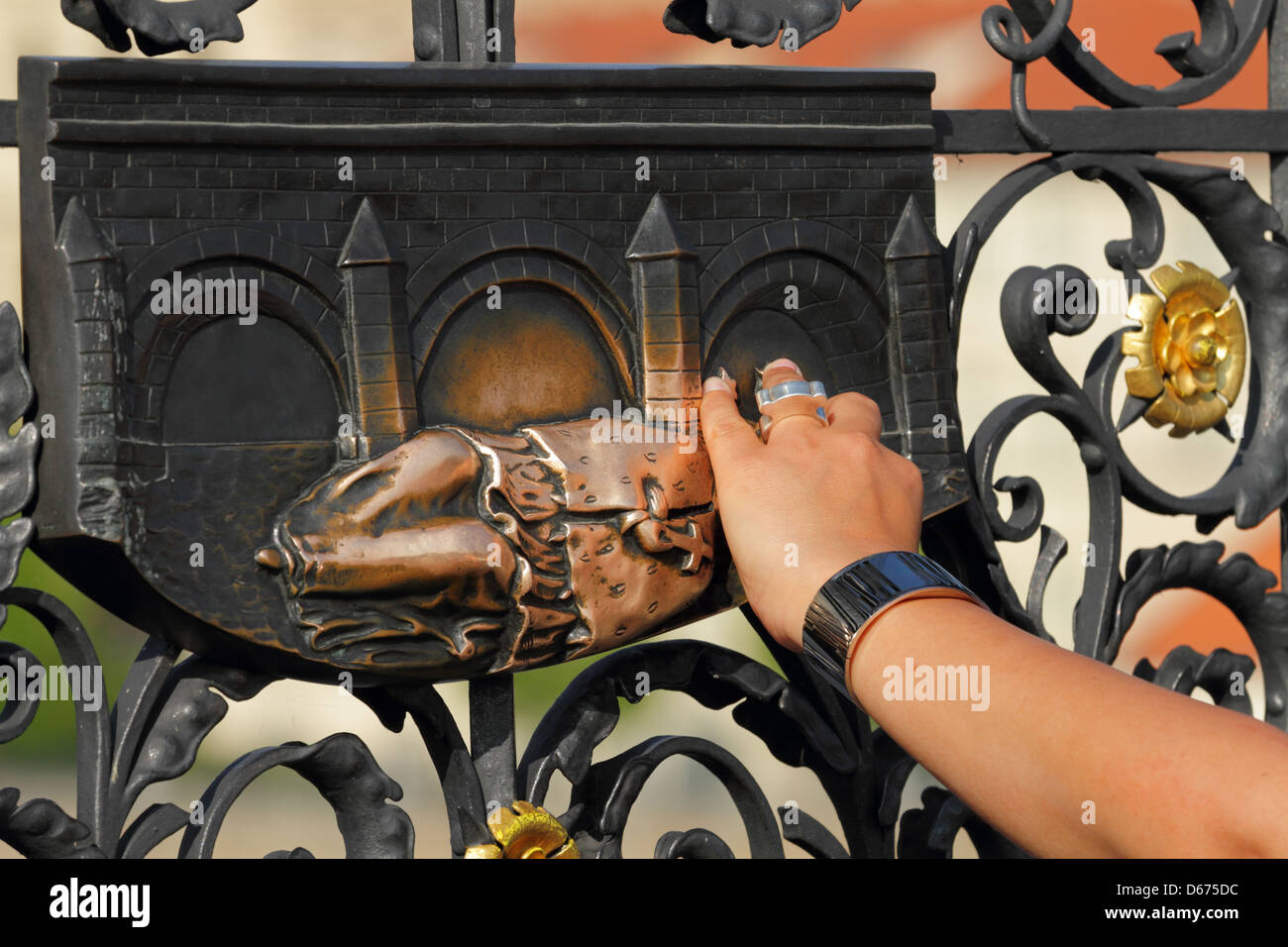 Charles Bridge some statues give luck when touched Stock Photo Alamy