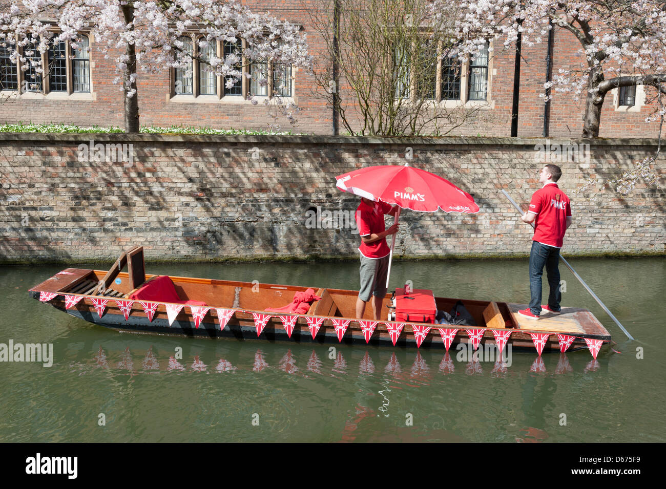 Cambridge, UK. 14 April 2013. A colourfully decorated punt sells drinks and snacks on the River Cam. The river was busy with tourists enjoying the warmest day of the year so far with temperatures hitting 20 degrees centigrade. Spring weather finally arrived after weeks of cold wet weather. Julian Eales/Alamy Live News Stock Photo
