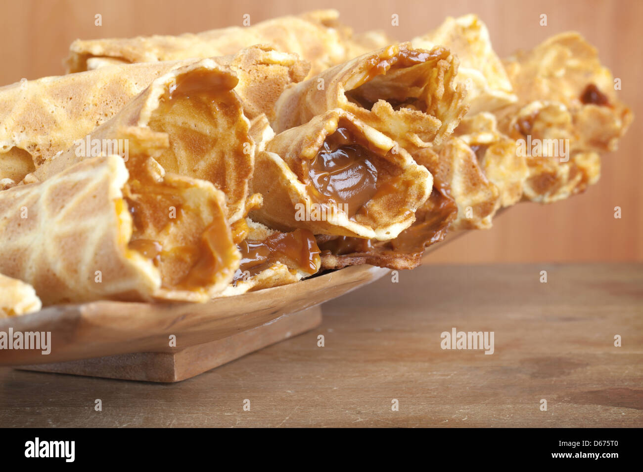 Closeup photo of homemade wafer cones with cream of sweet boiled condensed milk. Traditional Russian dessert Stock Photo