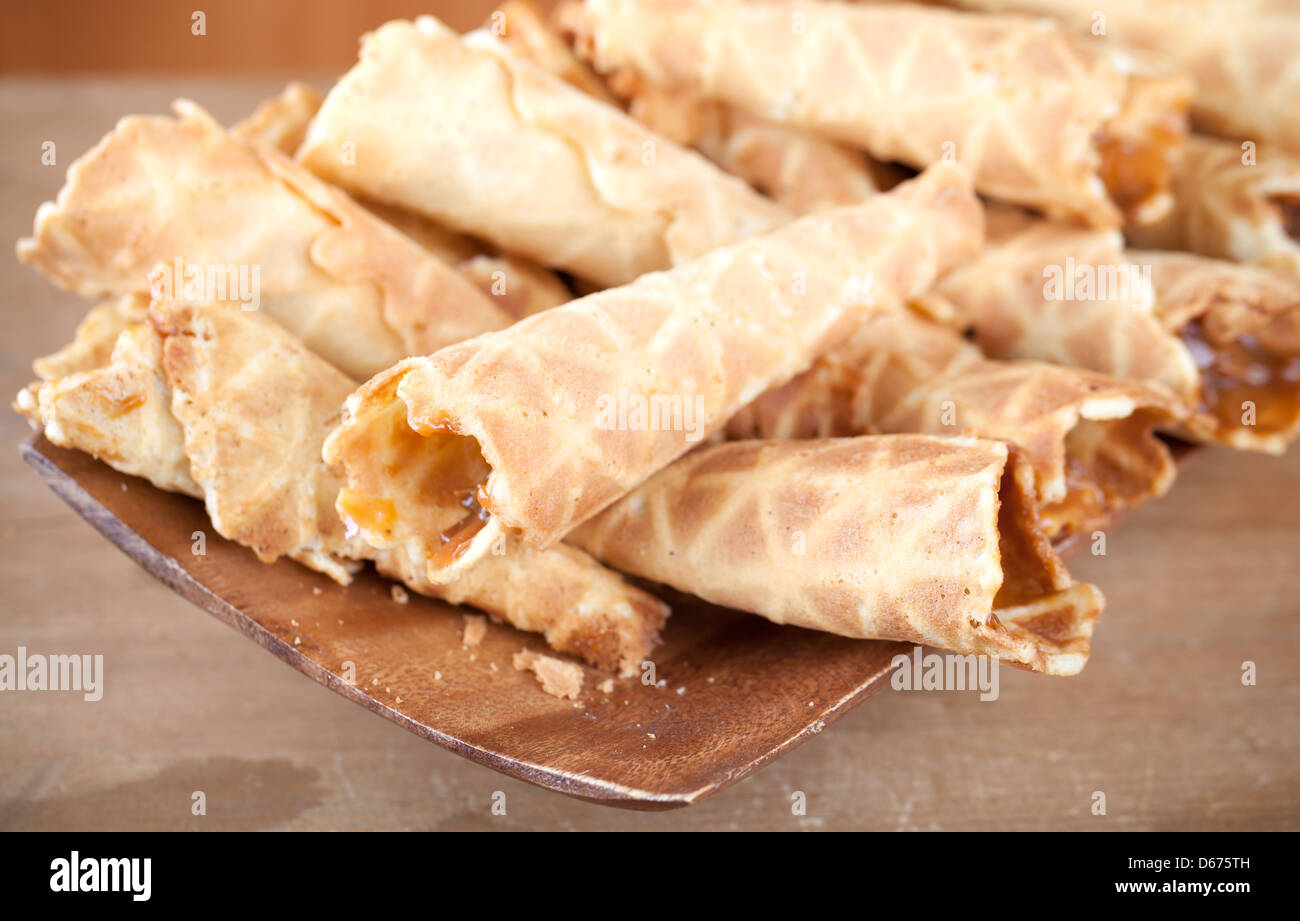 Homemade wafer cones with cream of sweet boiled condensed milk. Traditional Russian dessert Stock Photo