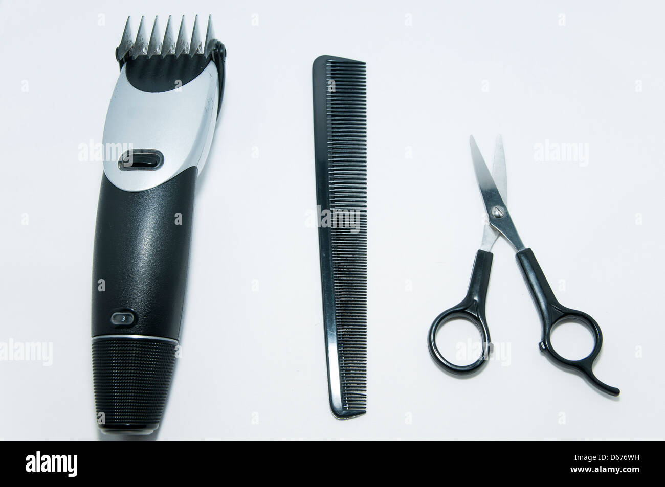 kid hairdresser cutting hair with a comb and scissors Stock Photo Alamy