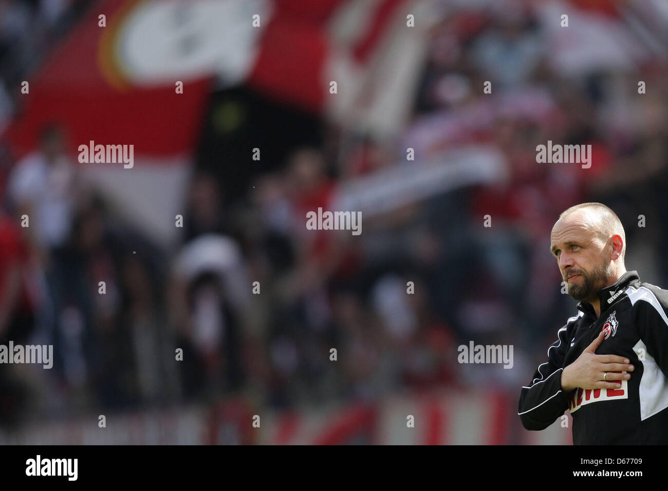Cologne' head coach Holger Stanislawski puts his hand on his chest before the 2nd Bundesliga soccer match between FC Cologne and VfR Aalen at RheinEnergieStadium in Cologne, Germany, 14 April 2013. Photo: Rolf Vennenbernd Stock Photo