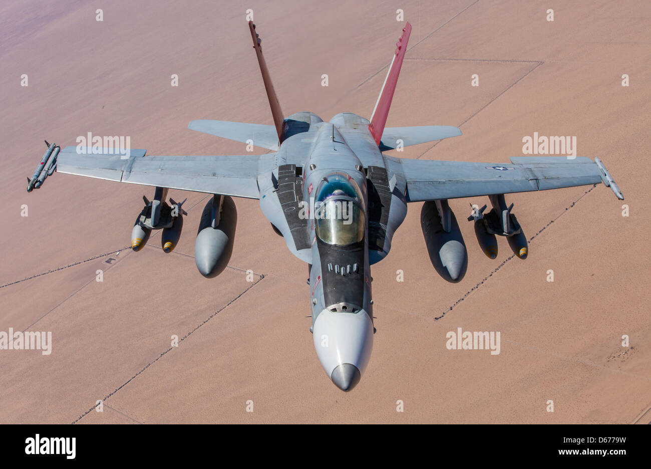 Maj. Clint Webber, the tactical aviation department head for Marine Aviation Weapons and Tactics Squadron 1, trains in an F-18 Hornet during the spring Weapons and Tactics Instructors' Course hosted by MAWTS-1 at Marine Corps Air Station Yuma, Ariz., March 30. WTI is a training evolution designed to promote the best possible skills in today's Marine Corps aviators. Stock Photo