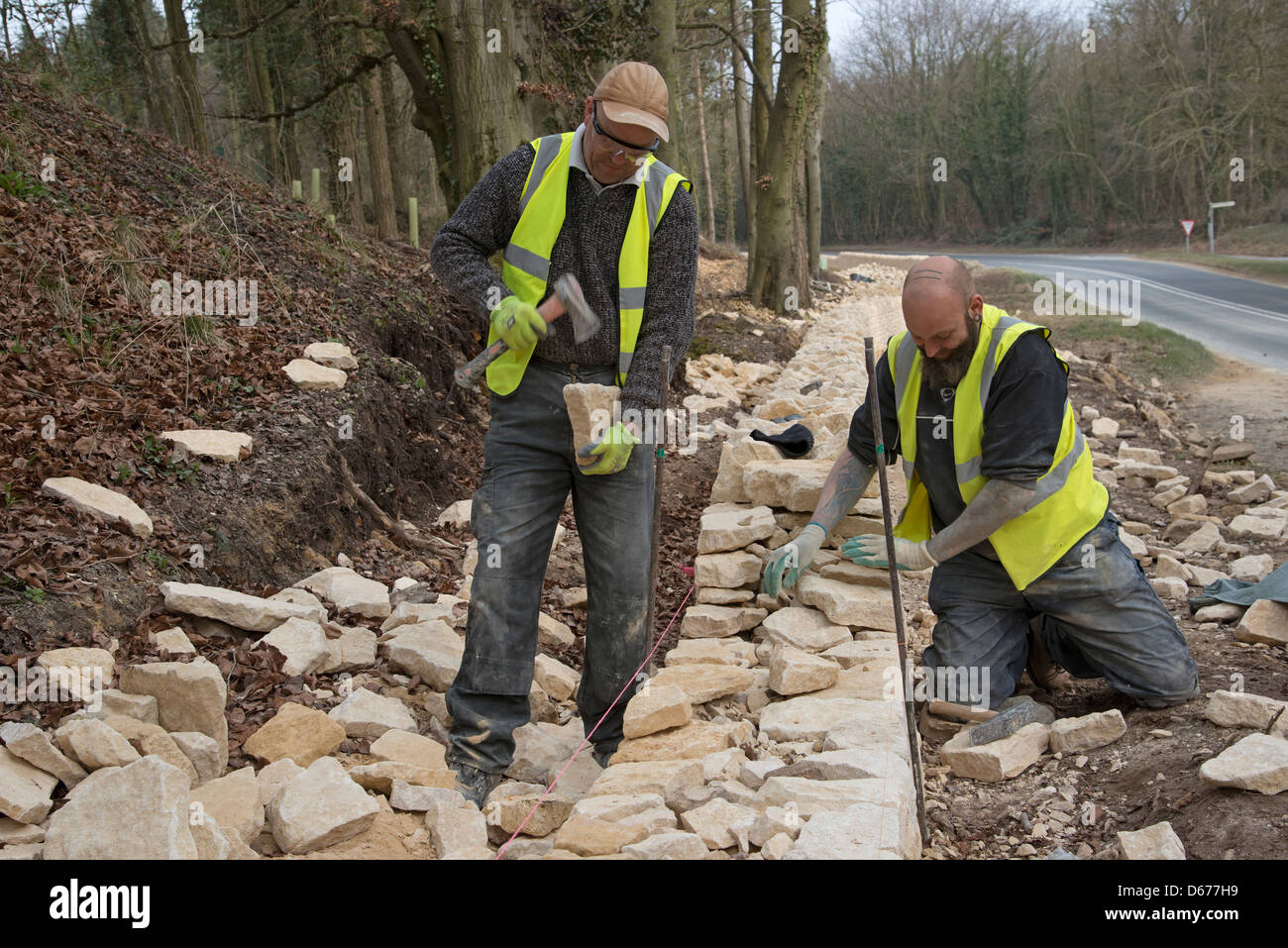 Dry stone walling on the roadside in the Cotswolds Gloucestershire UK Stock Photo