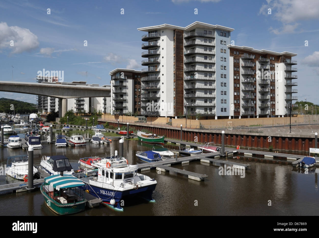 Boats moored in the Ely River in Cardiff Bay Wales UK, alongside ...