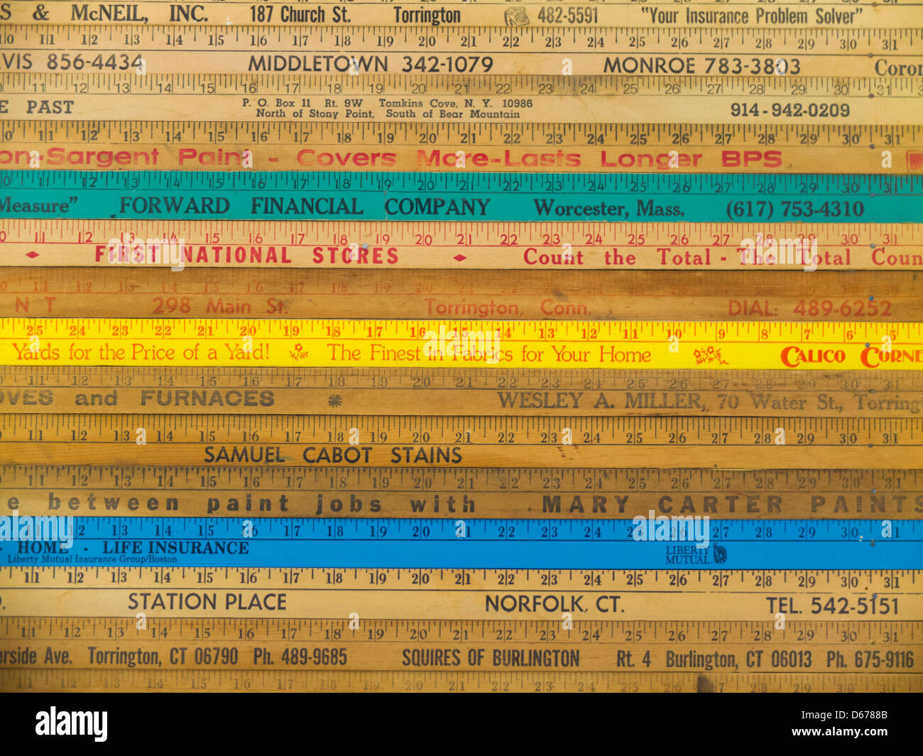 old wooden rulers with company names imprinted Stock Photo - Alamy