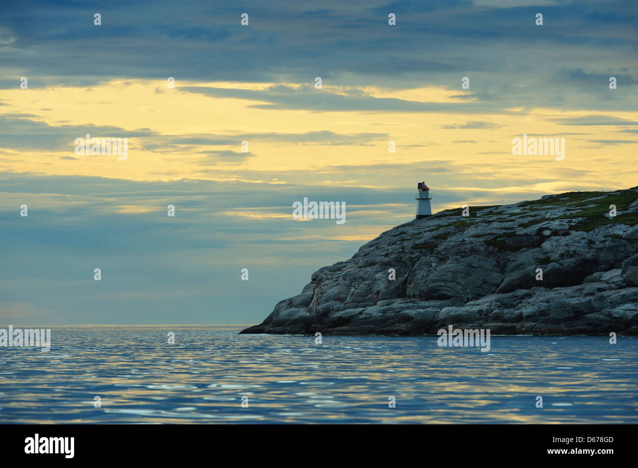 lighthouse, sunset at coastal landscape, lauvsnes, flatanger kommune, nord-trondelag fylke, norway Stock Photo