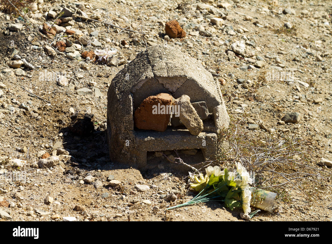 A simple grave marked by stones in a graveyard in Todos Santos, Mexico Stock Photo