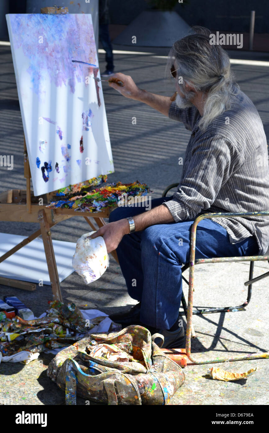 Painter on barcelona marina, Barcelona, Catalonia, Spain. Stock Photo