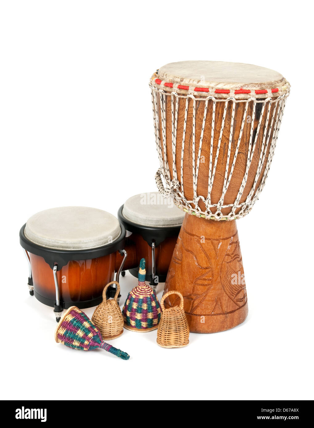 Percussion music instruments: djembe drum, bongos and caxixi shakers. Stock Photo