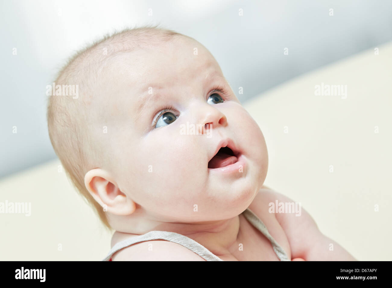 Nice impressed child look at parents with attention Stock Photo - Alamy