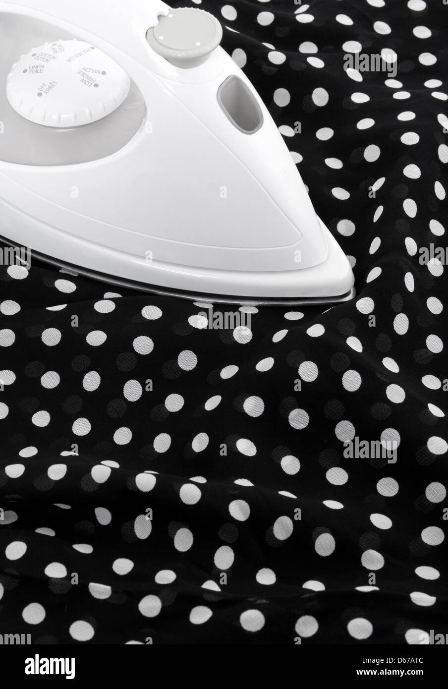 Ironing delicate black and white silky fabric Stock Photo Alamy