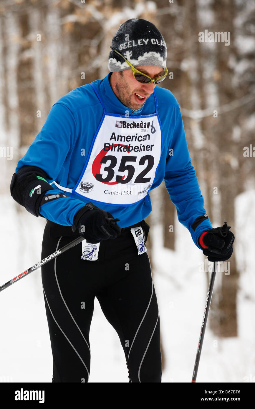 A skier on the trail between Cable and Hayward, Wisconsin competes in