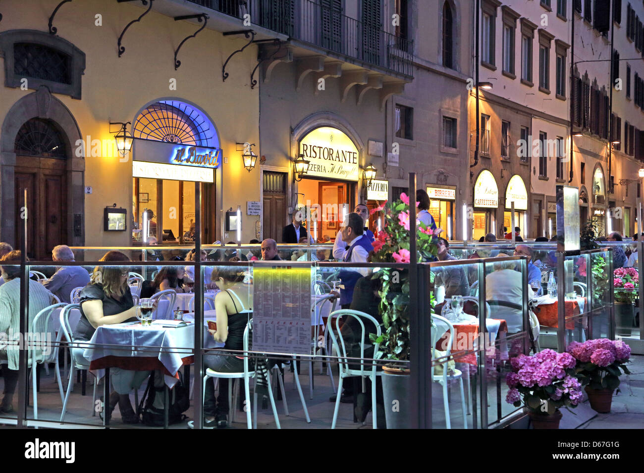 Restaurants in Piazza della Signoria at night in Florence Italy Stock Photo