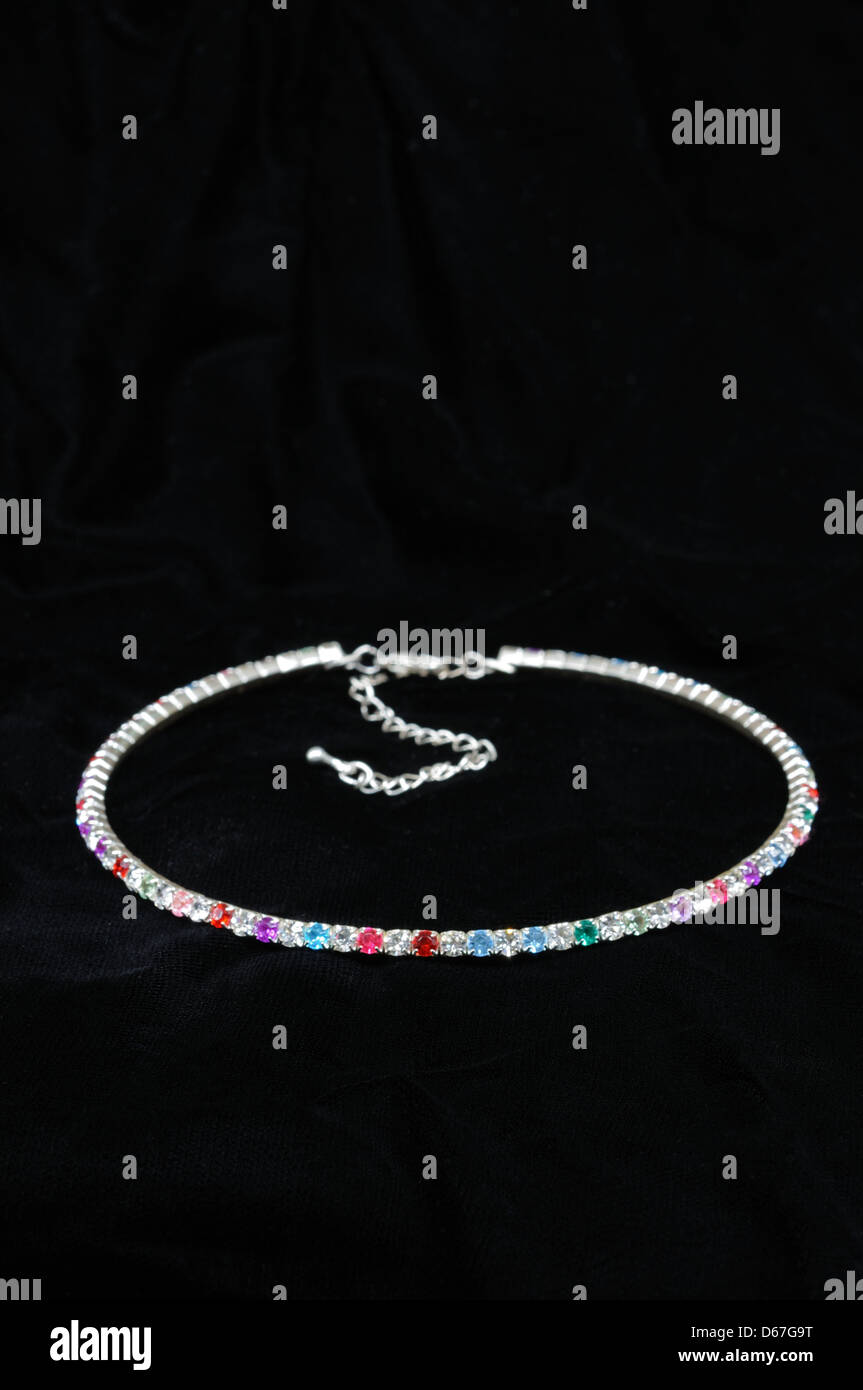 Colourful crystal choker against a black background. Stock Photo