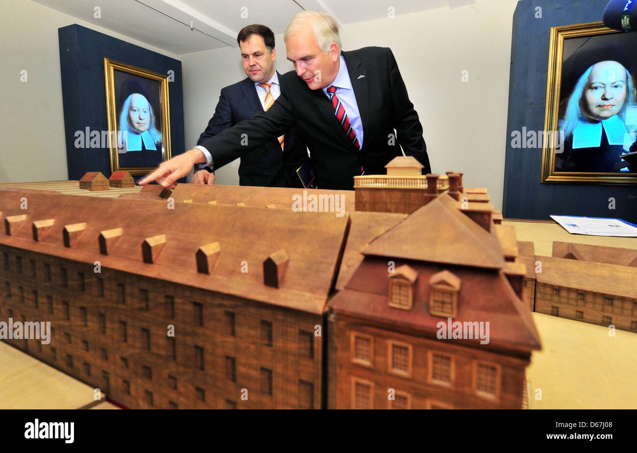 Minister of Culture of Saxony-Anhalt Stephan Dorgeloh (SPD, L) and Director of the Francke Foundations Thomas Mueller-Bahlke view a model of the buildings of the Francke Foundations at the former home of August Hermann Francke in Halle/Saale, Germany, 11 June 2012. The foundation will honour the 350th anniversary of their founder August Hermann Francke (1663-1727) with an extensive Stock Photo