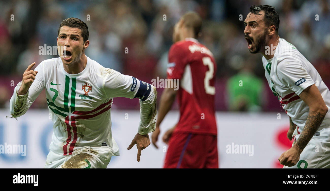 Portugal's Cristiano Ronaldo (L) celebrates scoring the 1-0 with team mate Hugo Almeida during the UEFA EURO 2012 quarter-final soccer match Czech Republic vs Portugal at the National Stadium in Warsaw, Poland, 21 June 2012. Photo: Jens Wolf dpa (Please refer to chapters 7 and 8 of http://dpaq.de/Ziovh for UEFA Euro 2012 Terms & Conditions)  +++(c) dpa - Bildfunk+++ Stock Photo