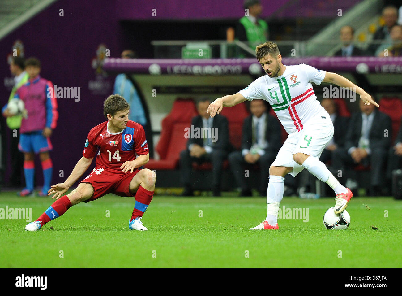Czech Republic's Vaclav Pilar tackles Portugal's Miguel Veloso during a Euro 2012 quarter final match between the Czech Republic and Portugal in Warsaw, Portugal, 21 June 2012. Photo: Revierfoto Stock Photo