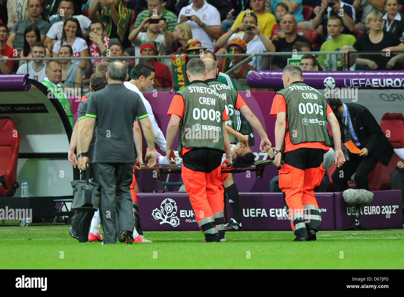Portugal's Helder Postiga is carruied off the field with an injury during a Euro 2012 quarter final match between the Czech Republic and Portugal in Warsaw, Portugal, 21 June 2012. Photo: Revierfoto Stock Photo