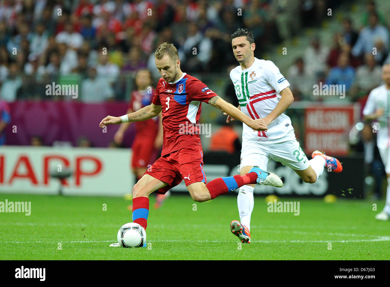 Czech Republic's Michael Kadlec (l) plays against Portugal's Helder Postiga during a Euro 2012 quarter final match between the Czech Republic and Portugal in Warsaw, Portugal, 21 June 2012. Photo: Revierfoto Stock Photo