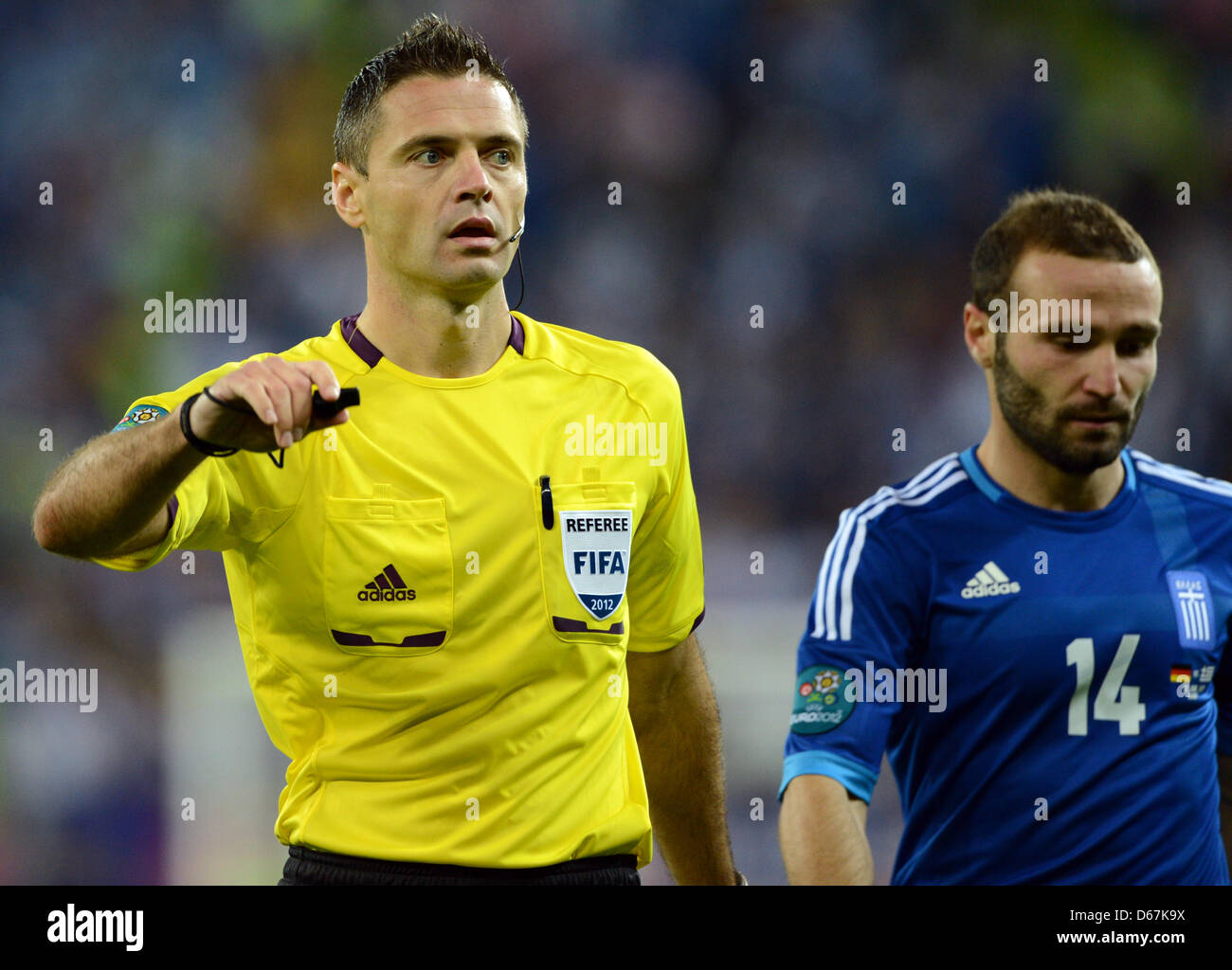 Slovenian referee Damir Skomina (L) gestures next to Greece's Dimitris Salpingidis during UEFA EURO 2012 quarter- final soccer match Germany vs Greece at Arena Gdansk in Gdansk, Poland, 22 June 2012. Photo: Andreas Gebert dpa (Please refer to chapters 7 and 8 of http://dpaq.de/Ziovh for UEFA Euro 2012 Terms & Conditions)  +++(c) dpa - Bildfunk+++ Stock Photo