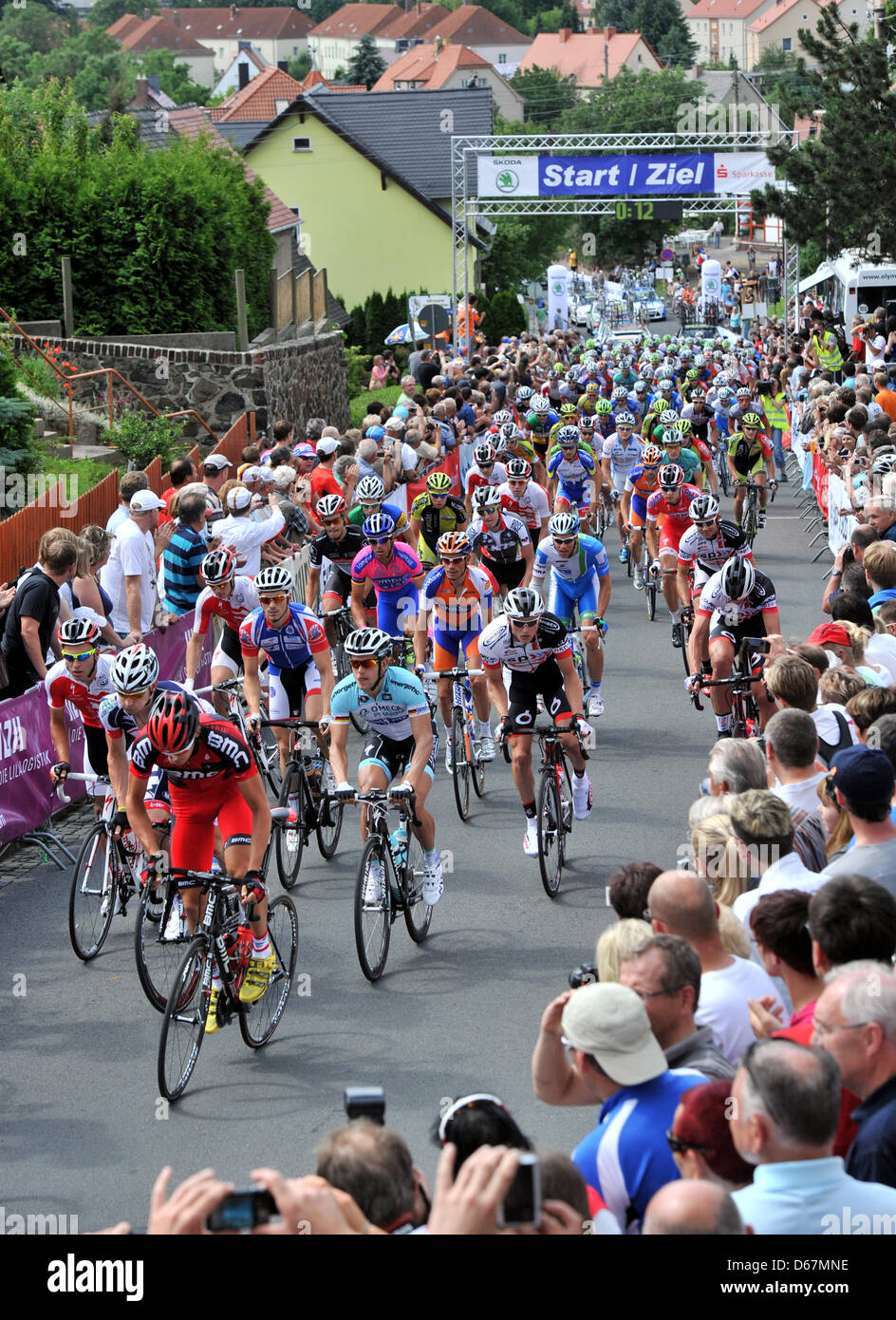 Cyclists are pictured during a street race of the German Cycling Tournament in Grimma, Germany, 24 June 2012. Photo: Hendrik Schmidt Stock Photo