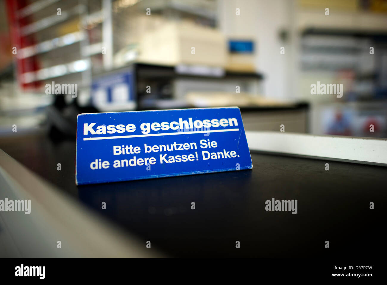 ILLUSTRATION - An illsutrated picture shows a 'Checkout Counter Closed' sign at a store of insolvent drugstore chain Schlecker in Dresden, Germany, 27 June 2012. 2800 Schlecker stores all over Germany close their doors for the last time today at 3 PM. The only task then left for more than 13,000 Schlecker employees is cleaning up one last time. Photo: ARNO BURGI Stock Photo