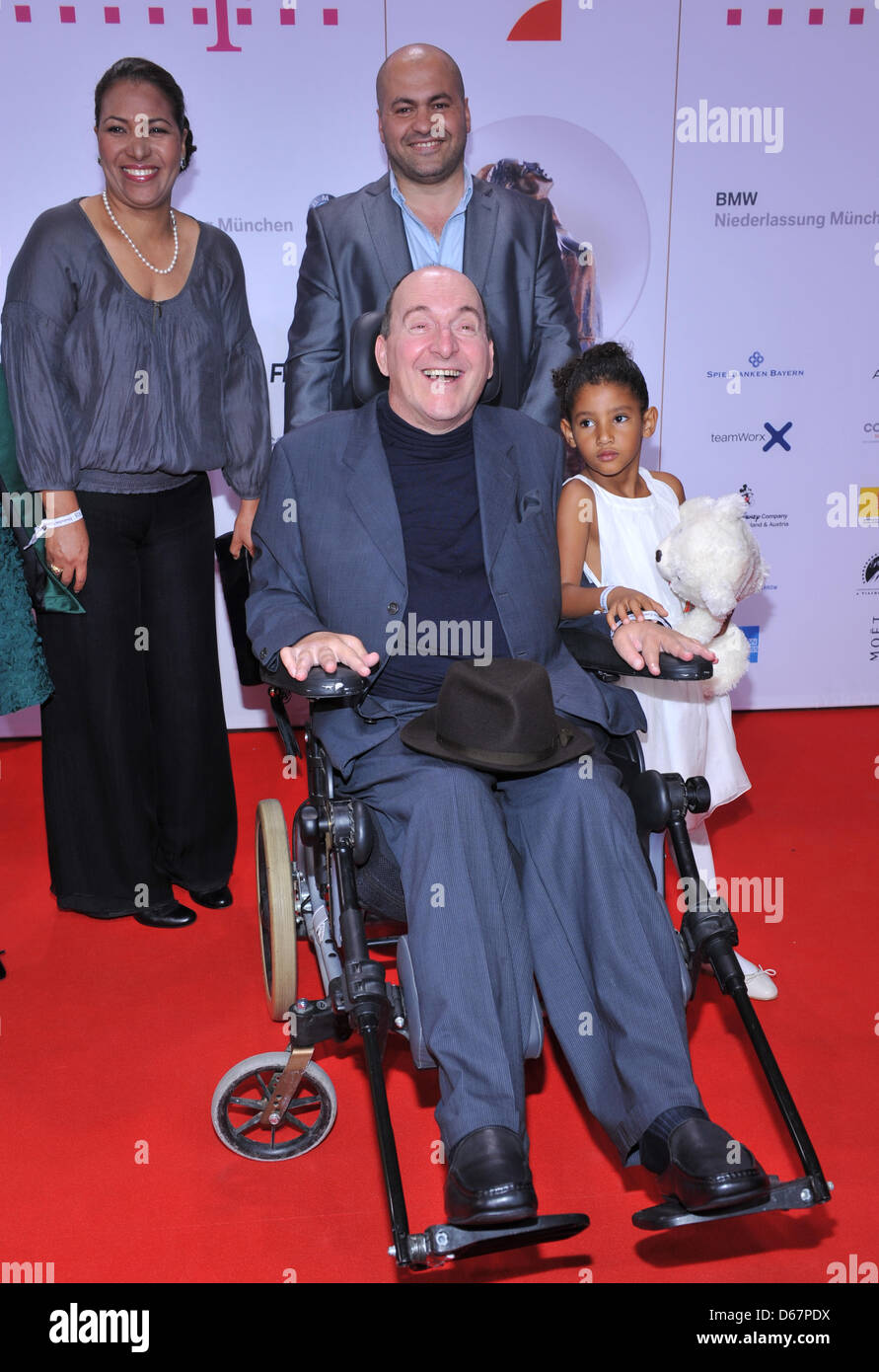 Actor Philippe Pozzo di Borgo (in a wheel chair), his sister-in-law Naima  Plaza, his daughter Wijdane and actor Abdel Sellou arrive at the DIVA 2012  entertainment award show in Munich, Germany, 26