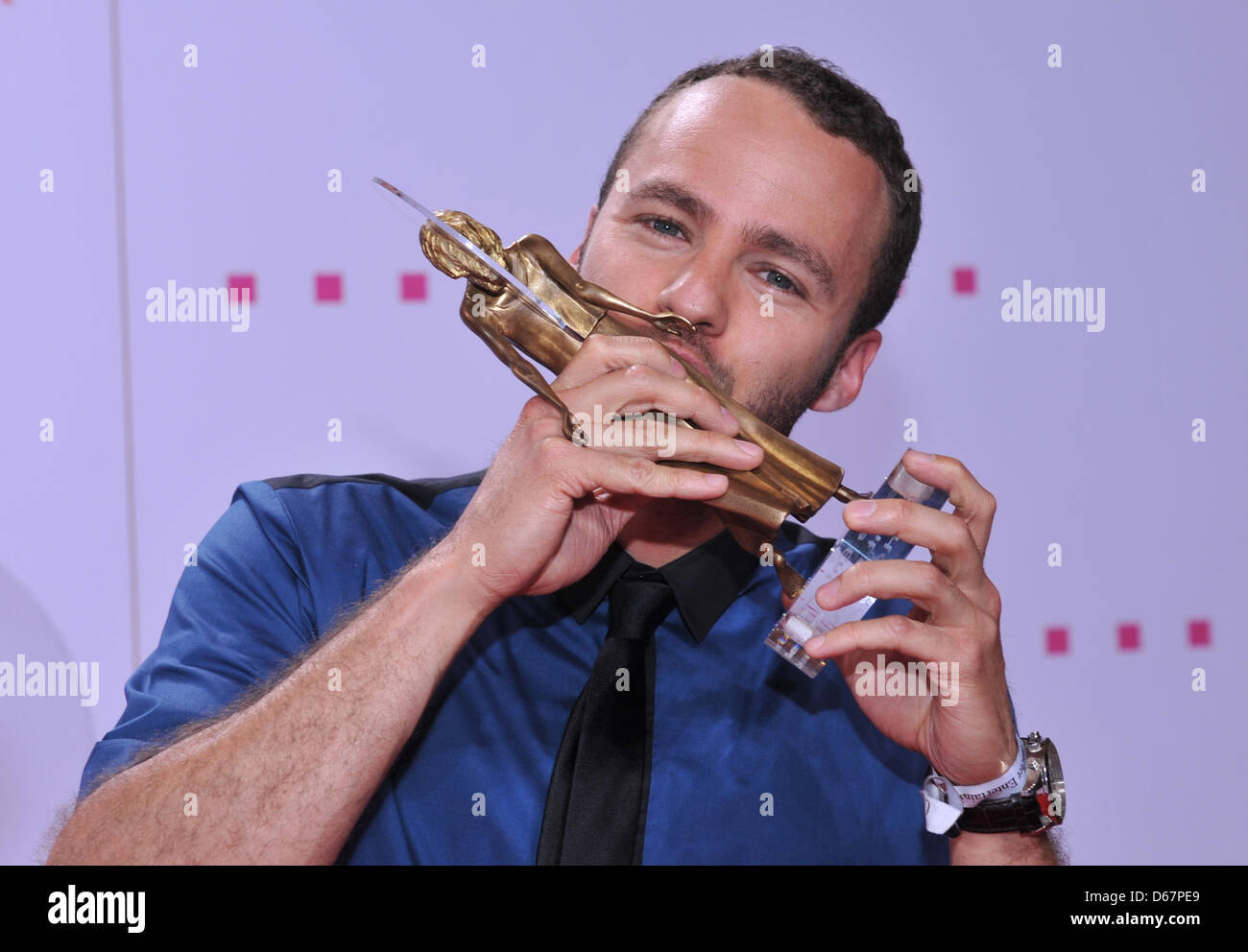 British singer Marlon Roudette kisses his award in the 'Talent of the Year' category at the DIVA 2012 entertainment award show in Munich, Germany, 26 June 2012. German entertainment prize 'Diva' was awarded for the 22nd time. The prize is awarded to people with extraordinary achievements in life and sustained success with audience and critics by Constantin Entertainment. Photo: Urs Stock Photo