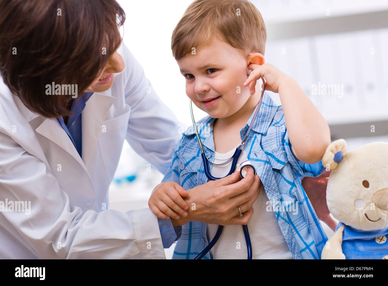 listening to heartbeat,pediatrician Stock Photo Alamy