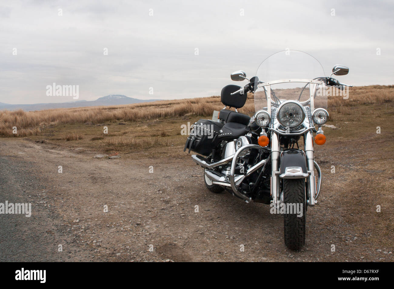 Harley Davidson FLSTC Softail Heritage Classic 2013 pictured against a moorland backdrop Stock Photo