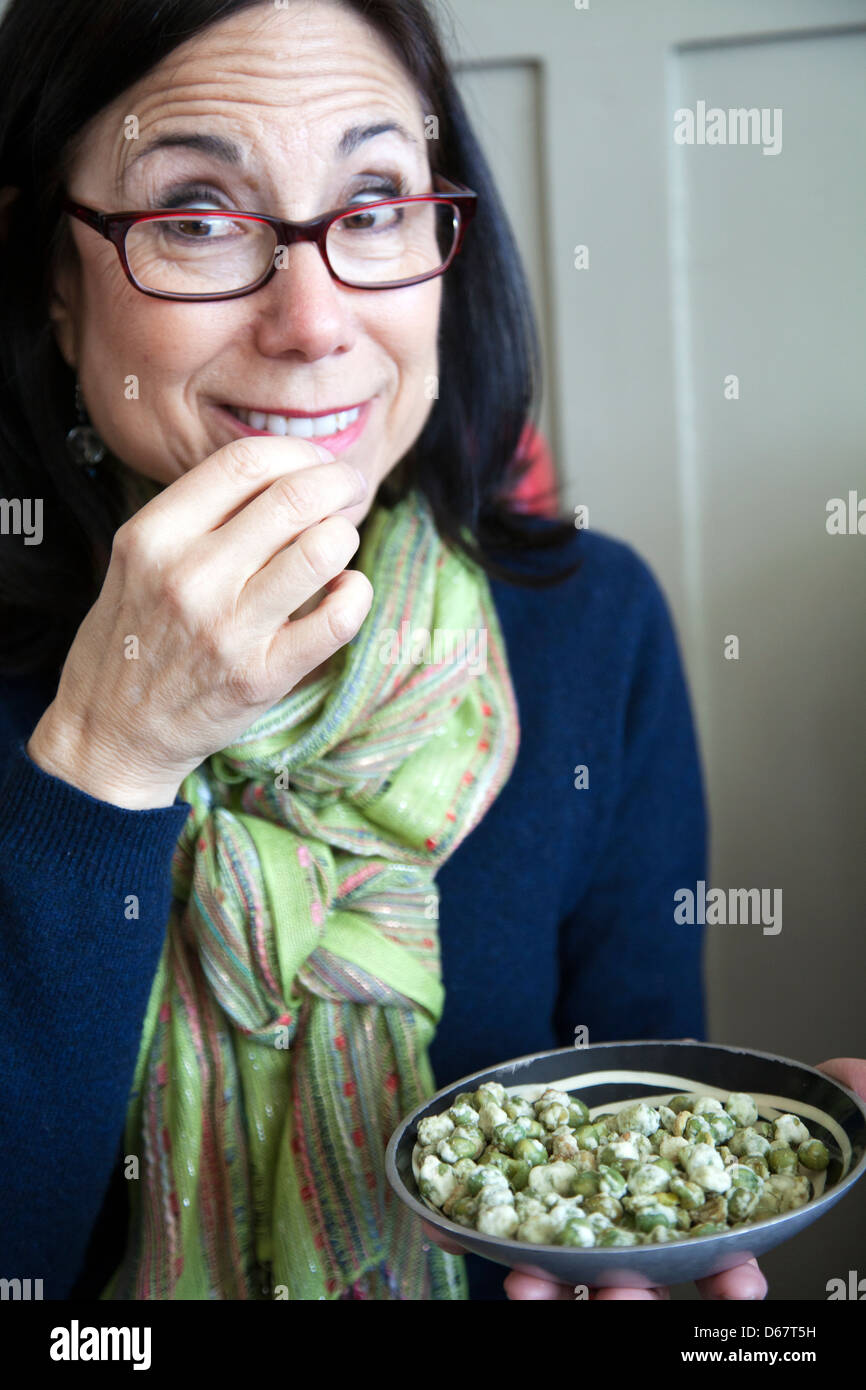 Woman eating Wasabi Pea Snack at Pub London UK Stock Photo Alamy