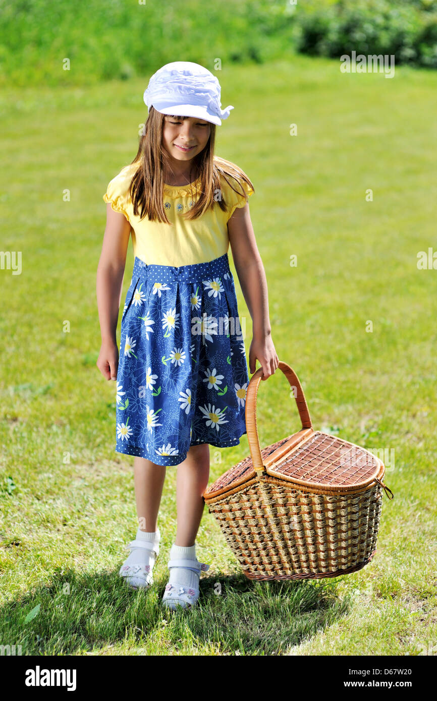 Girl with picnic basket Stock Photo Alamy