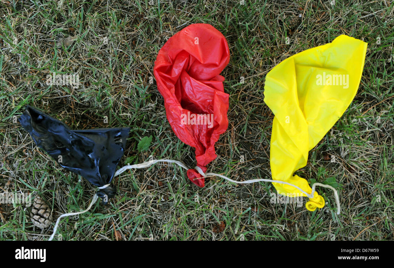 A black, red and yellow balloon is bursted in Aukrug, Germany, 29 June ...