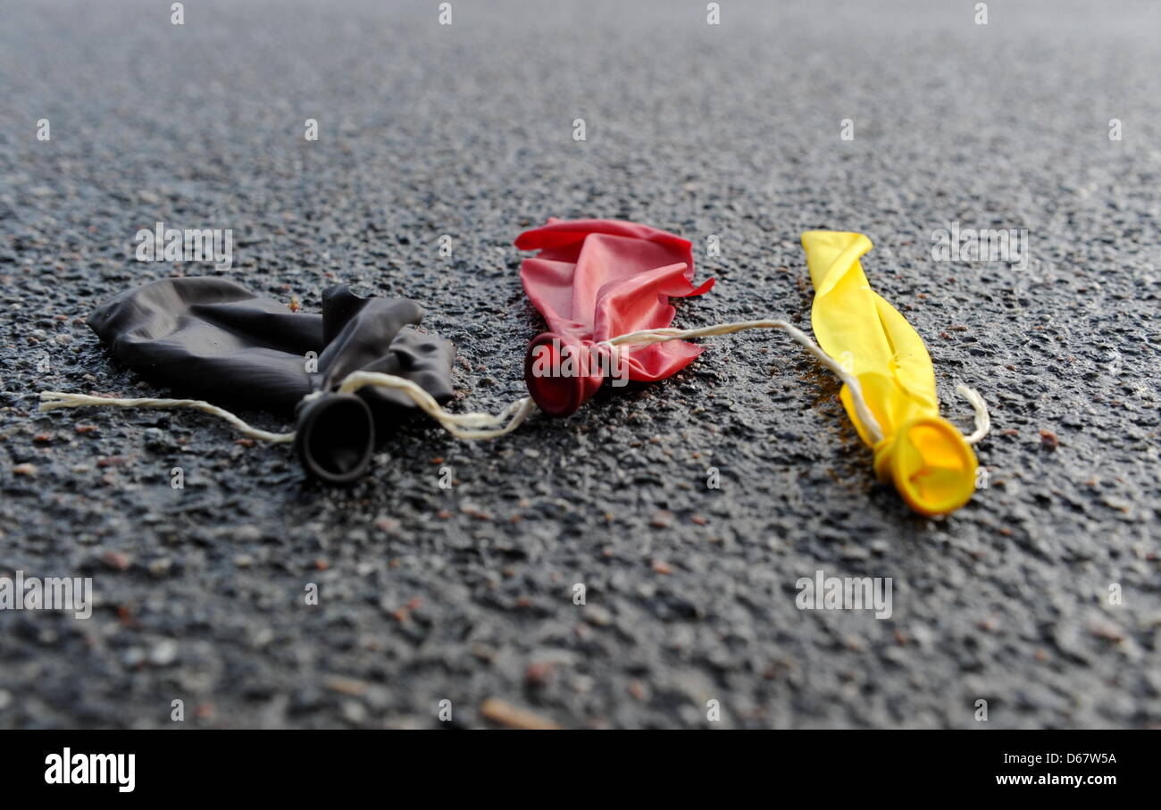 A black, red and yellow balloon is bursted in Aukrug, Germany, 29 June ...