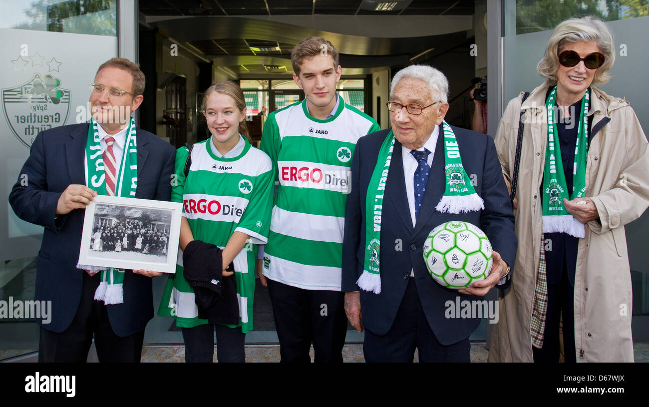 Former US Secretary of State Henry Kissinger (2-R) stands next to his wife Nancy, his son David (L) and his grandchildren Sam and Sophie the stadium of the German Bundesliga soccer club SpVgg Greuther Fuerth in Fuerth, Germany, 29 June 2012. Kissinger, who is honory citizen of Fuerth, visited his hometown with family members. Photo: DANIEL KARMANN Stock Photo